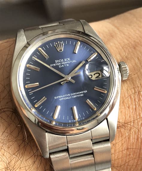 rolex oyster perpetual date blue with gold bevel